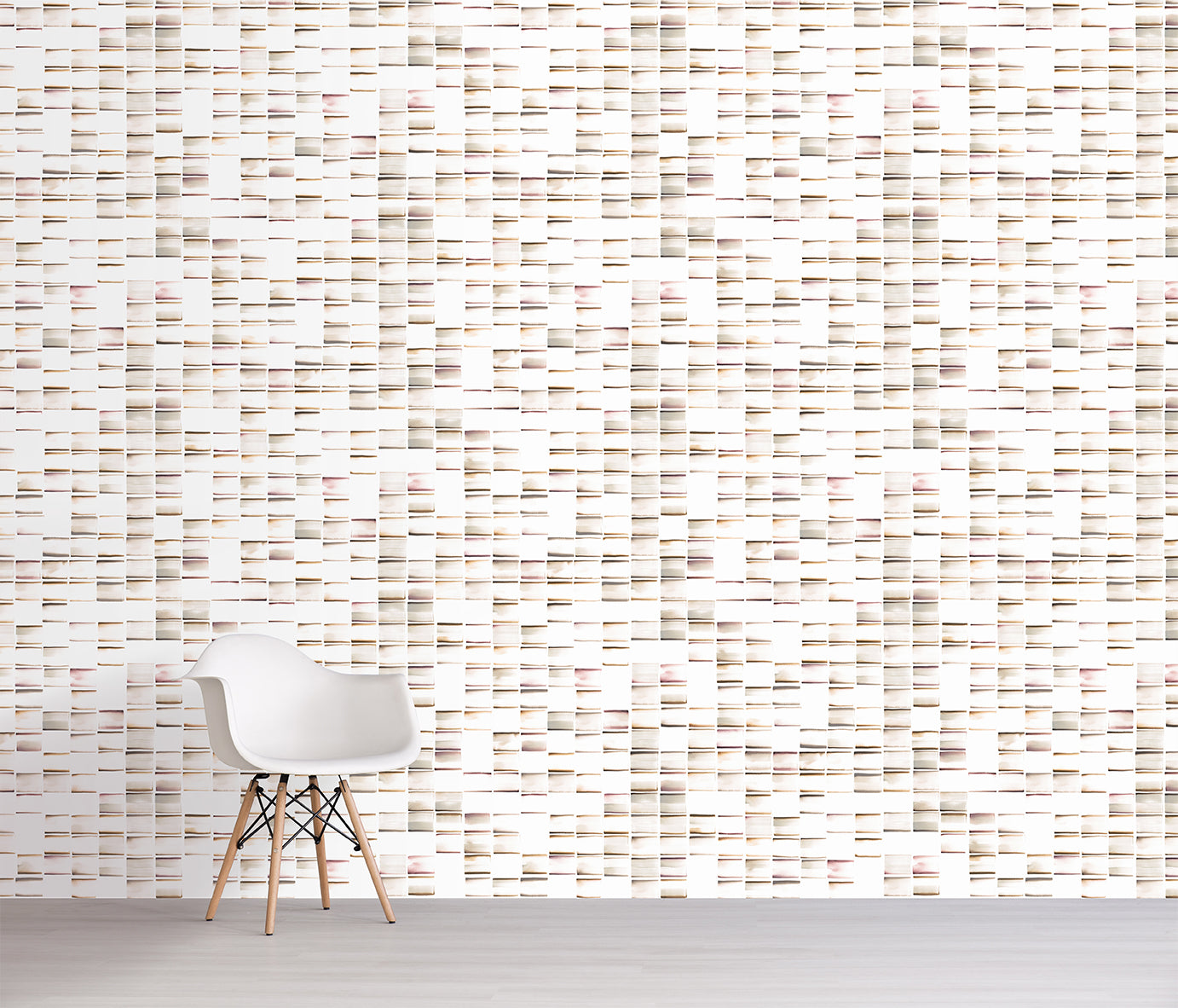 White chair in front of a brown textured wall with horizontal lines
