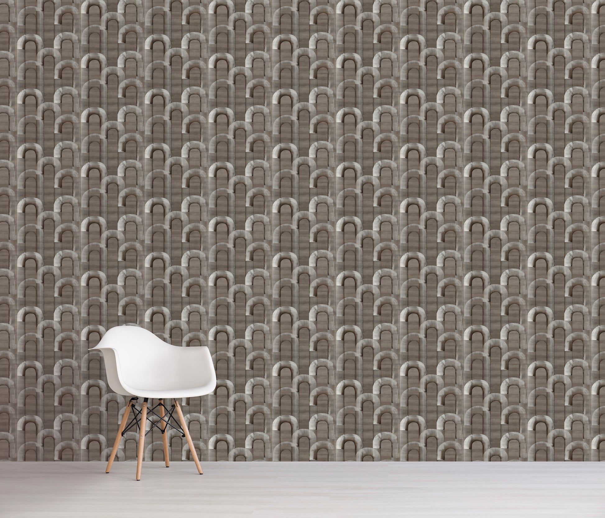 White chair in front of a wall with gray geometric patterned wallpaper