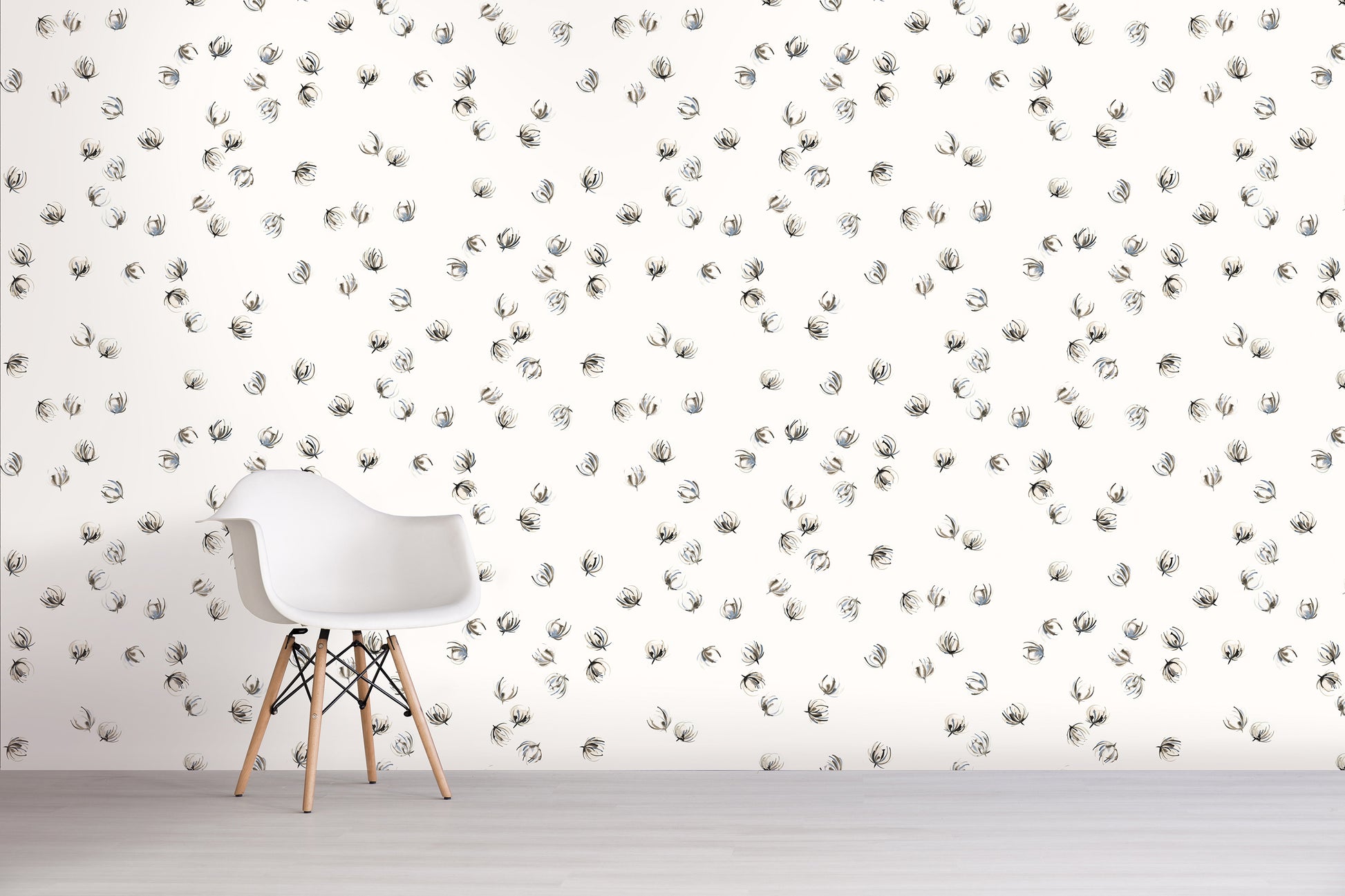 White chair in front of a wall with gray floral pattern