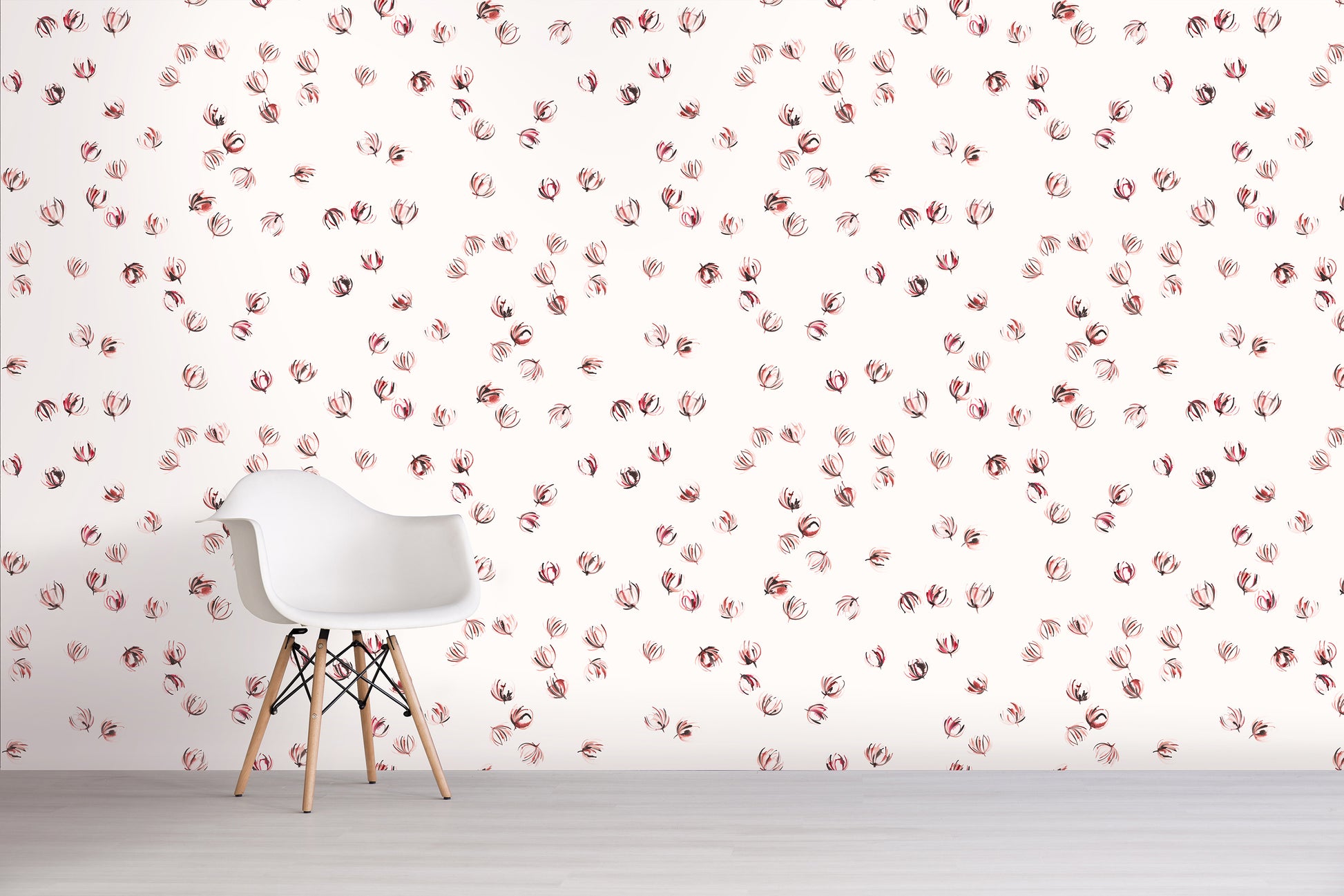 White chair in front of a wall with pink floral pattern