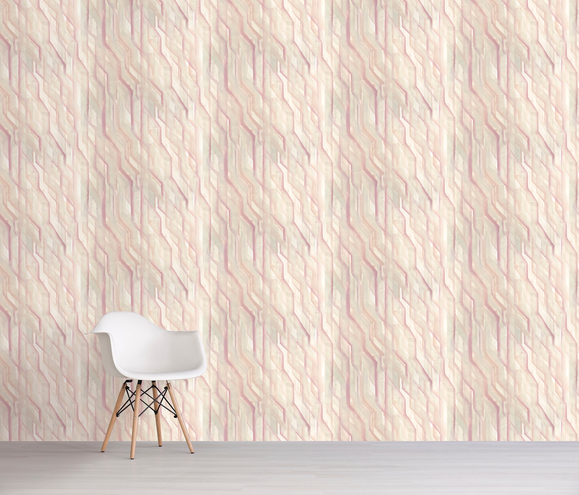 White chair in front of a textured light pink wall with geometric pattern