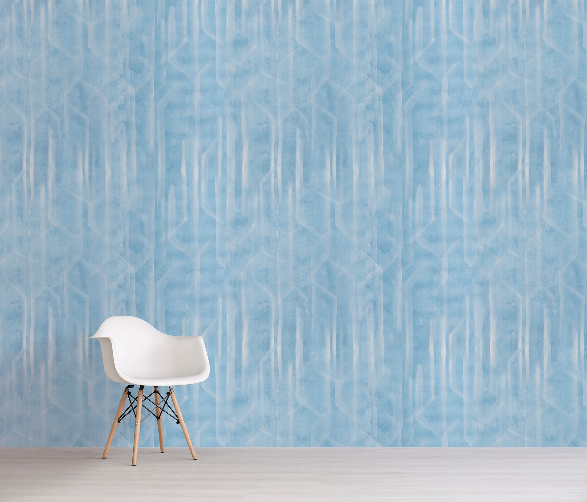 White chair against a blue patterned wall