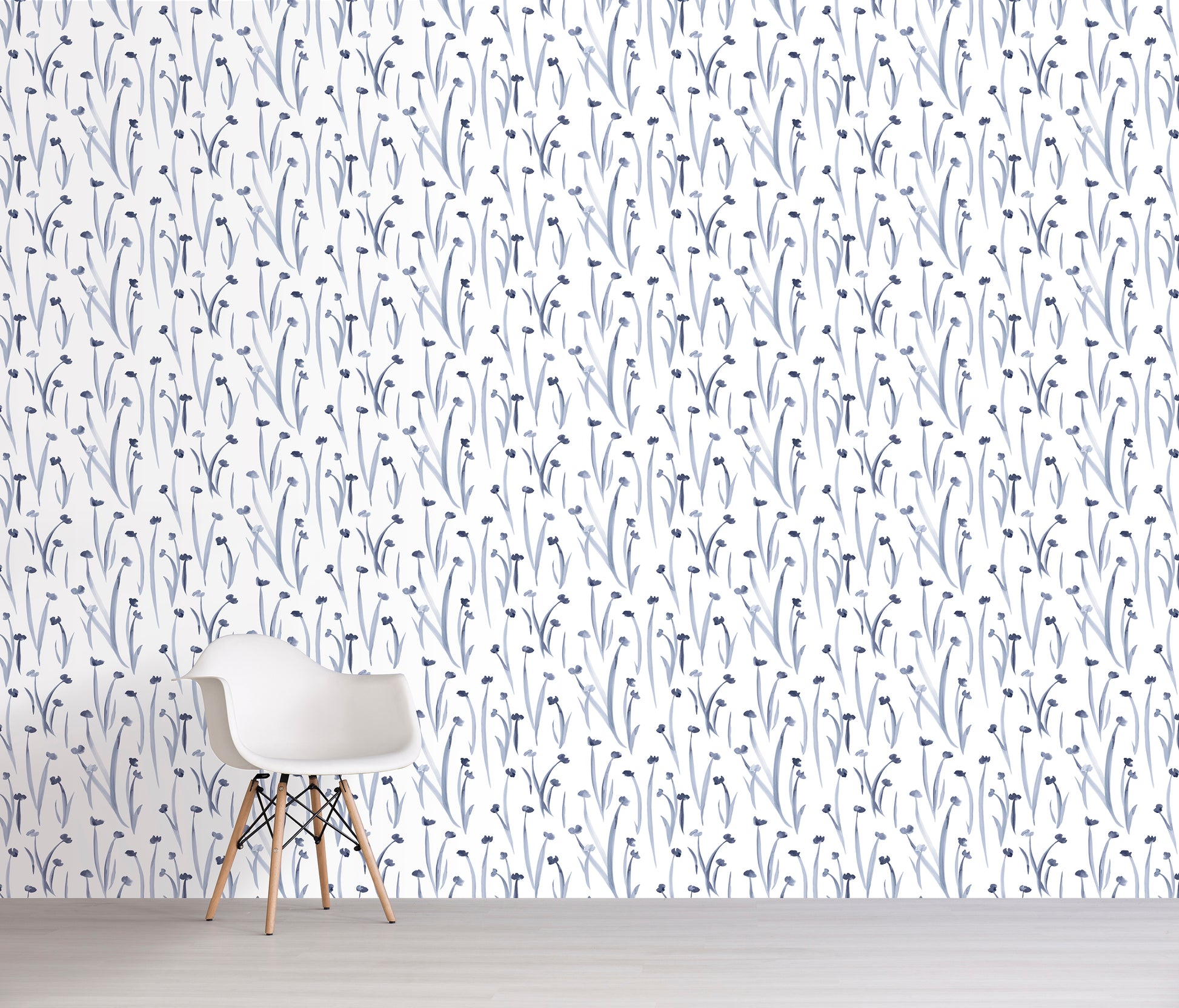 Wallpaper with blue flowers on a white background, featuring a chair against the wall.