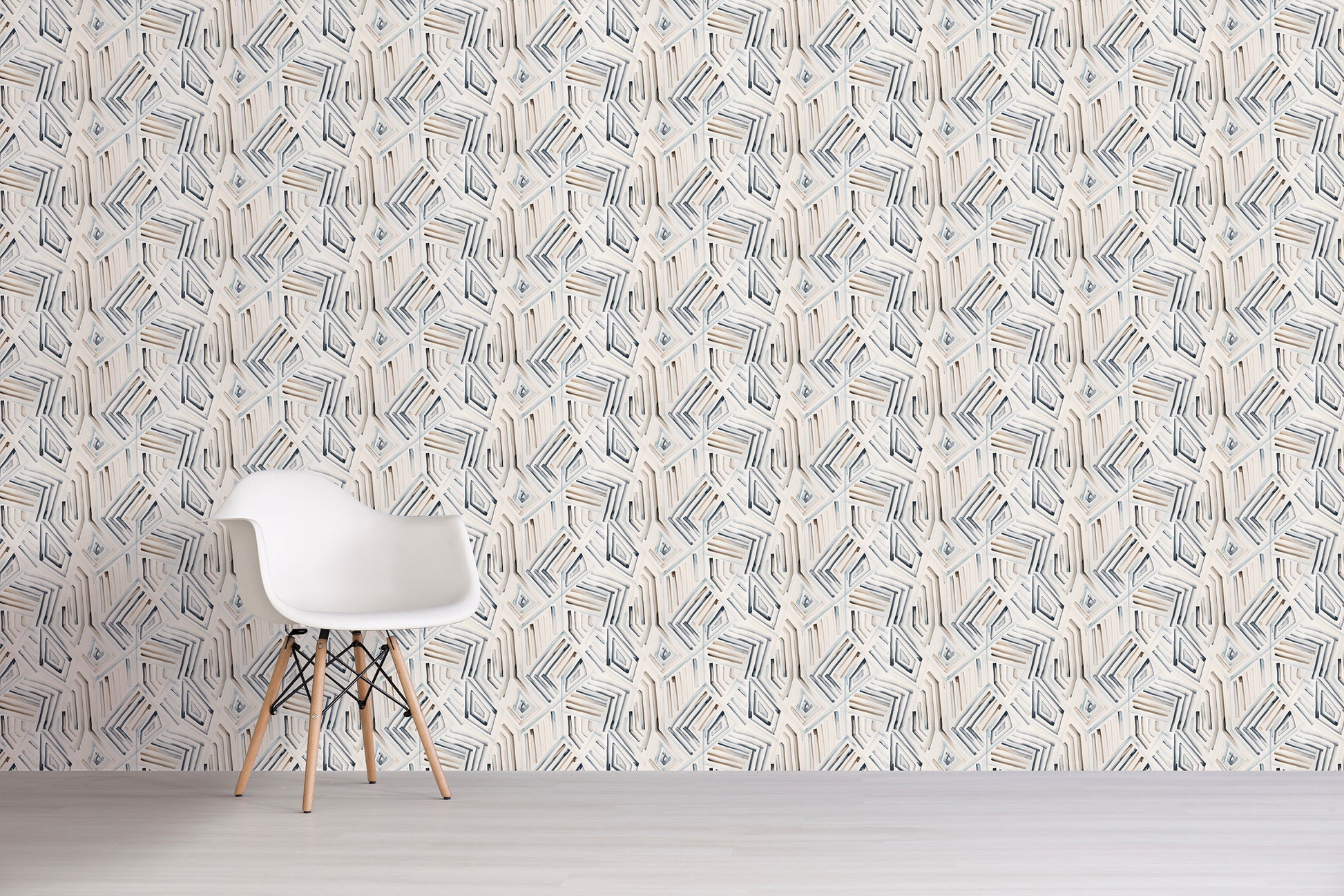 Patterned grey and blue wallpaper with a chair in front of it