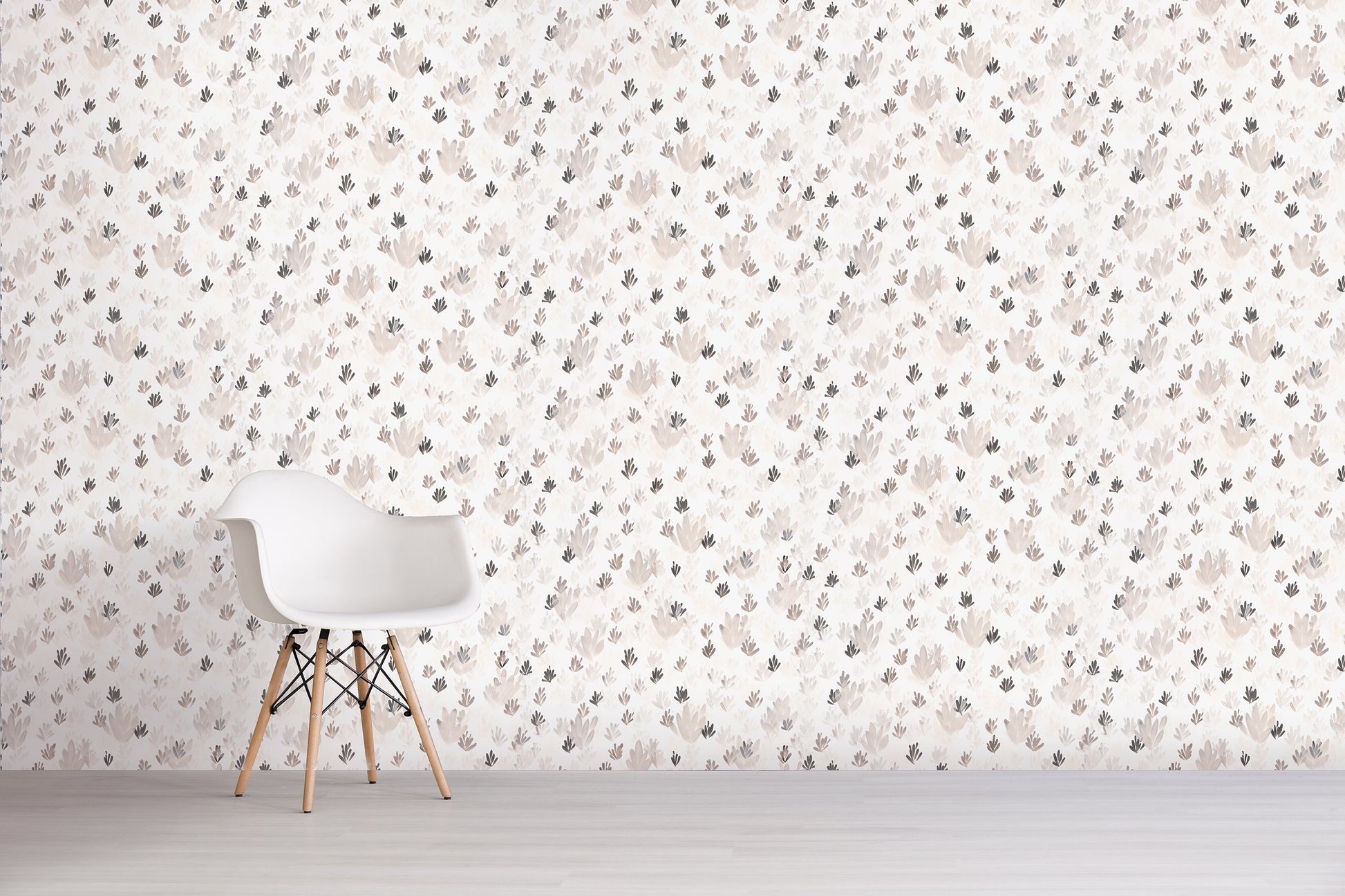 White chair against a wall with a grey floral pattern