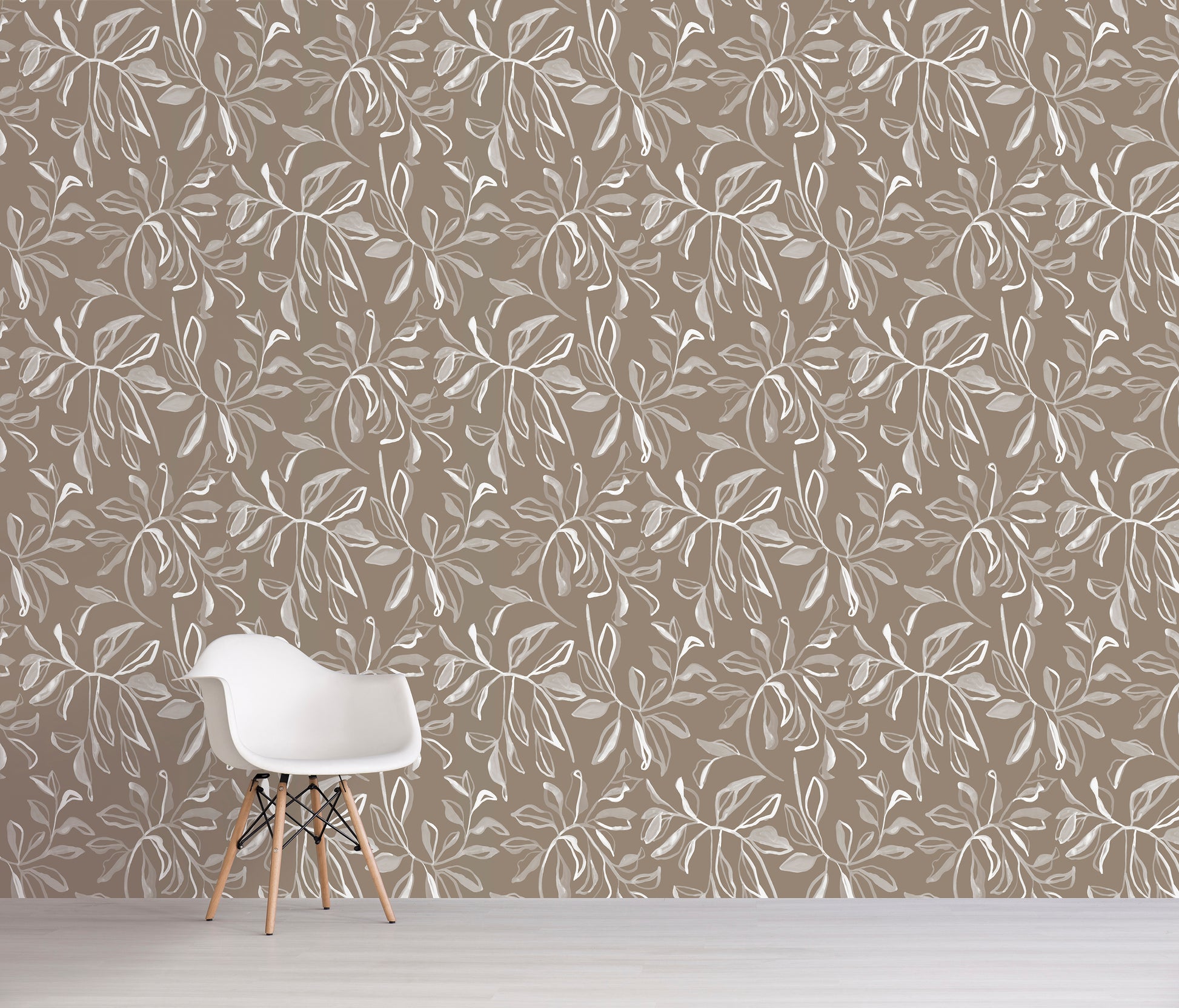 Wallpaper with white leaf pattern on brown background in a room with a white chair.