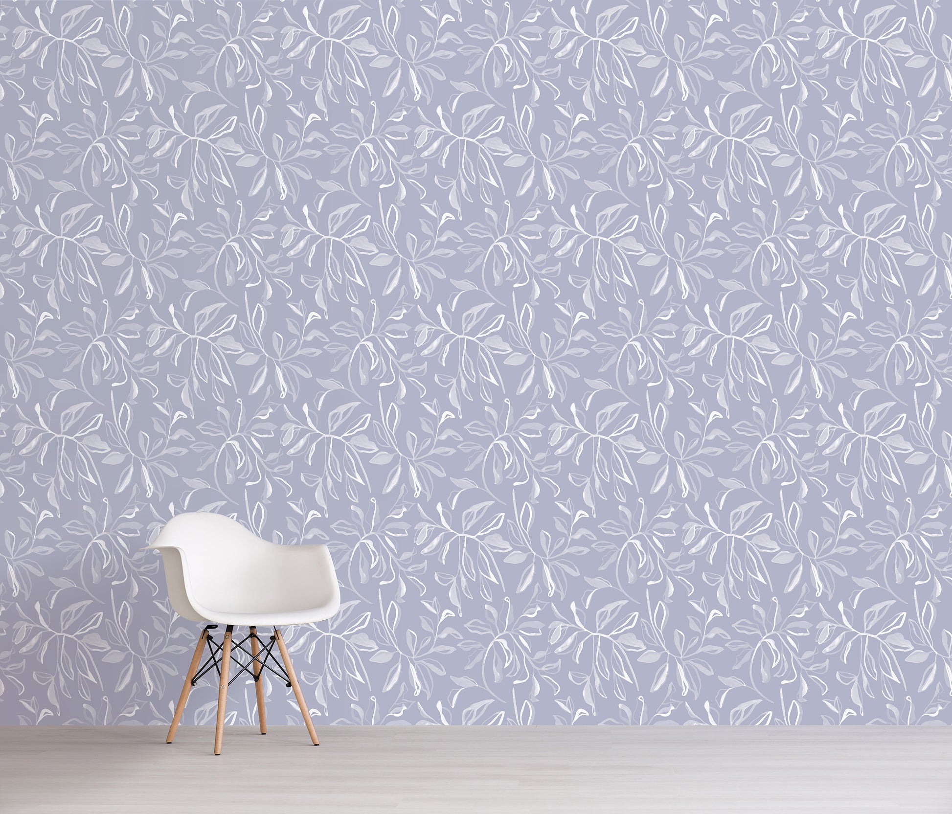 White chair in front of a wall with light blue floral pattern