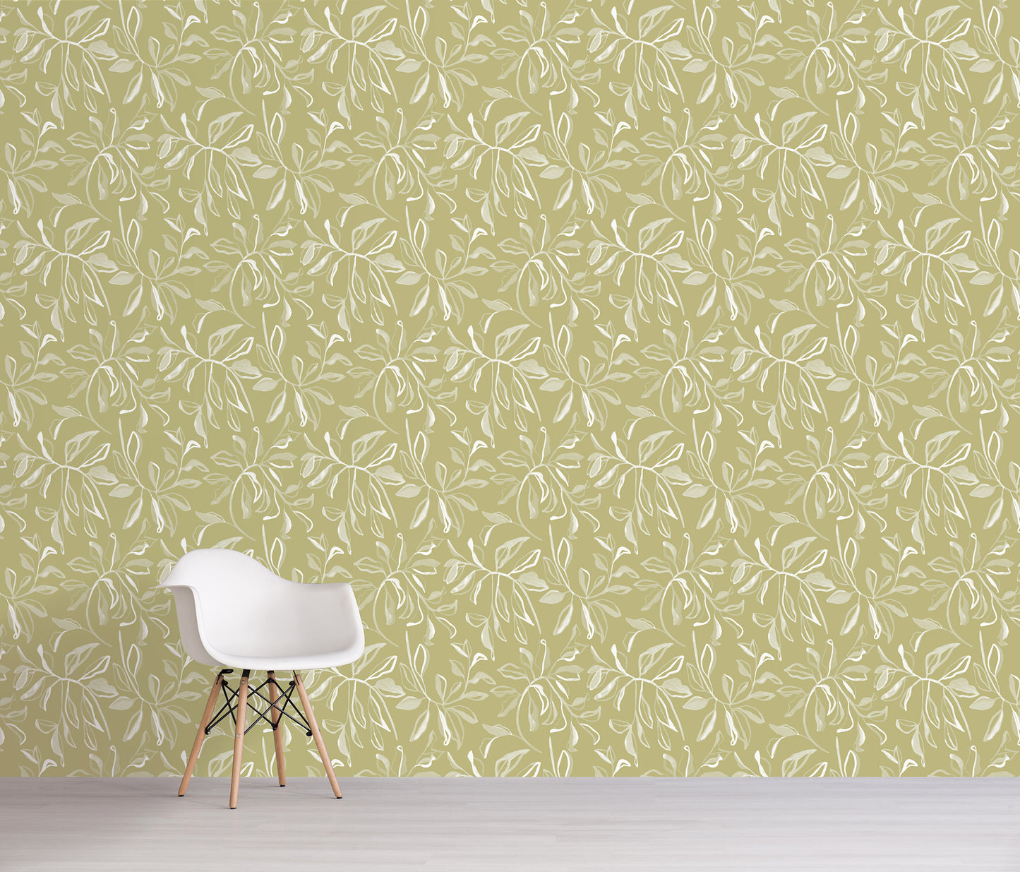 White chair against a green wall with a subtle floral pattern