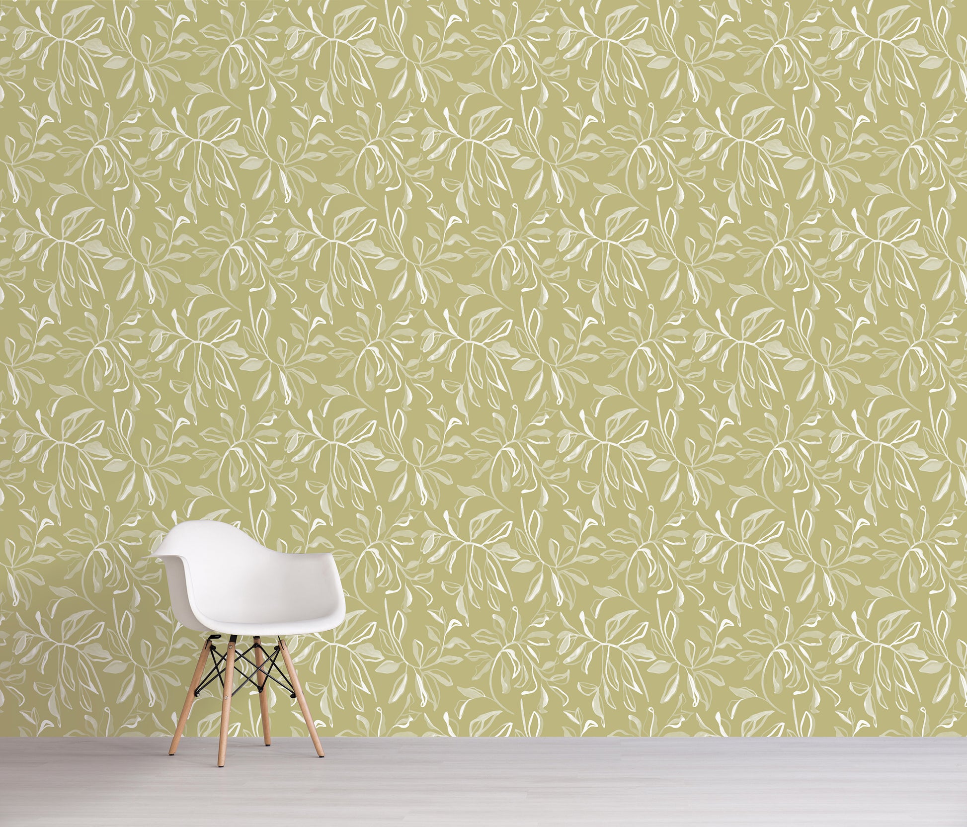 White chair against a green wall with a subtle floral pattern