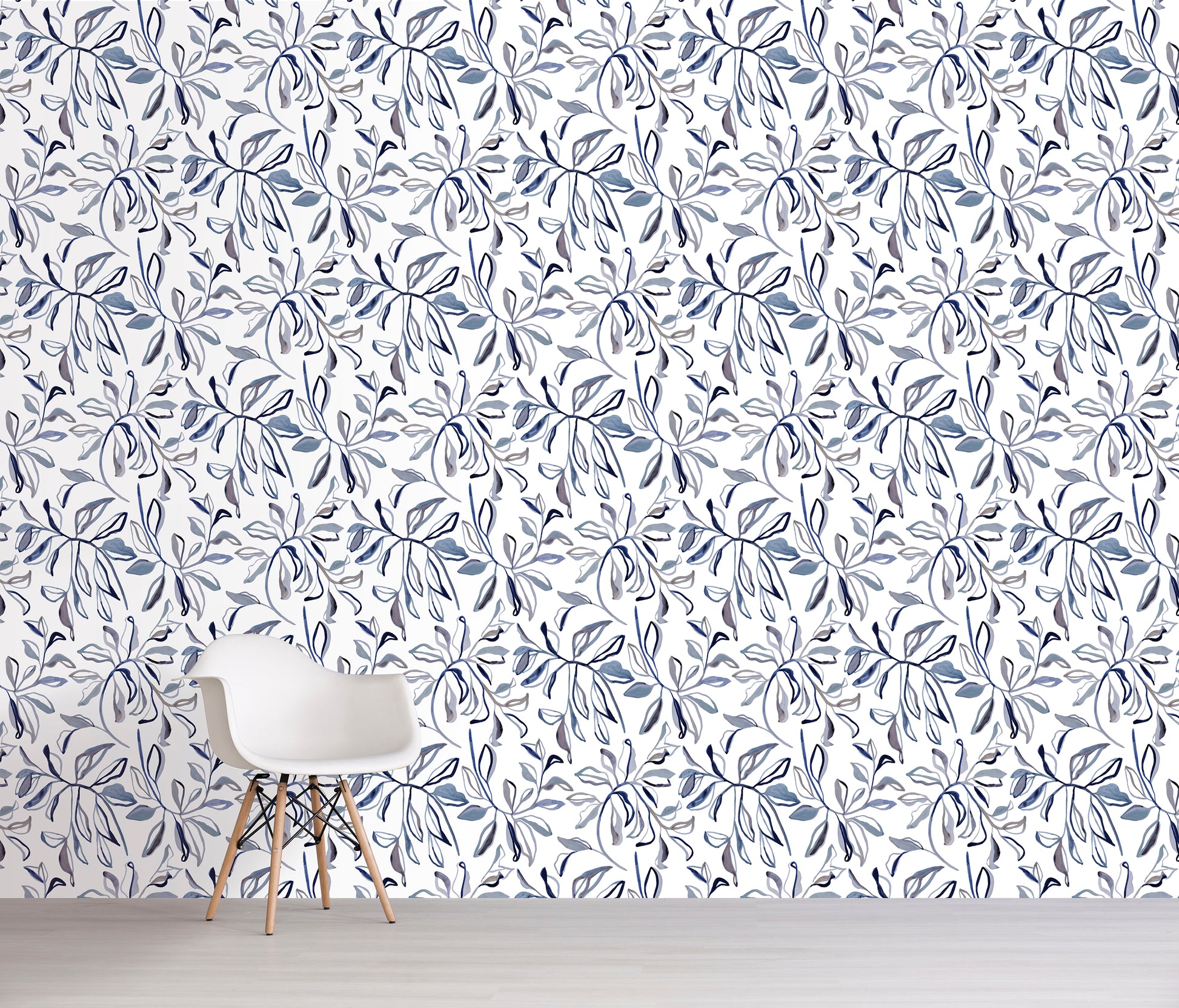 Wallpaper with a floral pattern in blue and white on a plain wall.