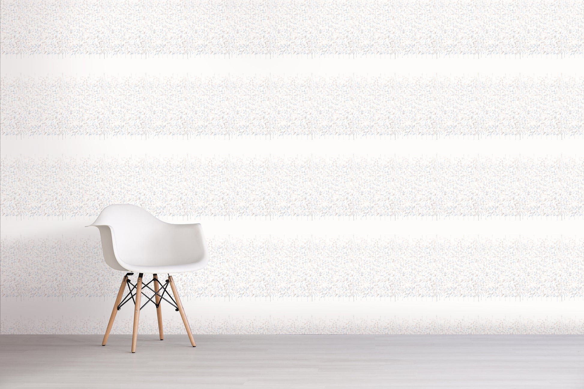 Modern white chair with wooden legs against a blue floral textured wall.