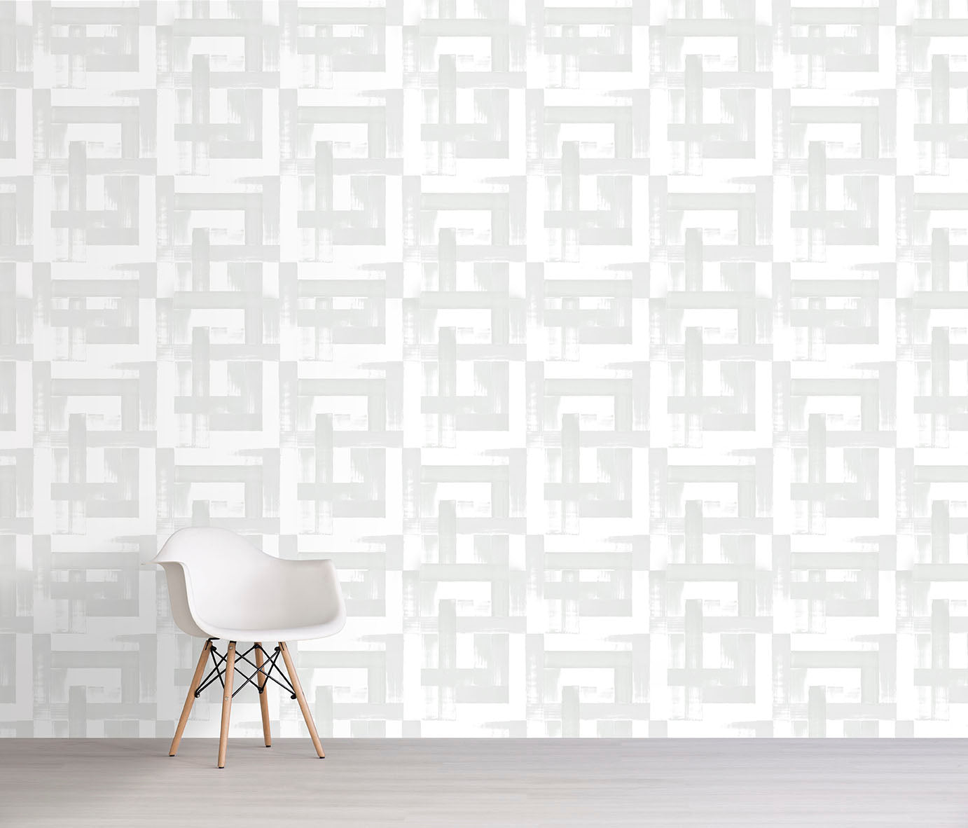 White chair against a white geometric patterned wall