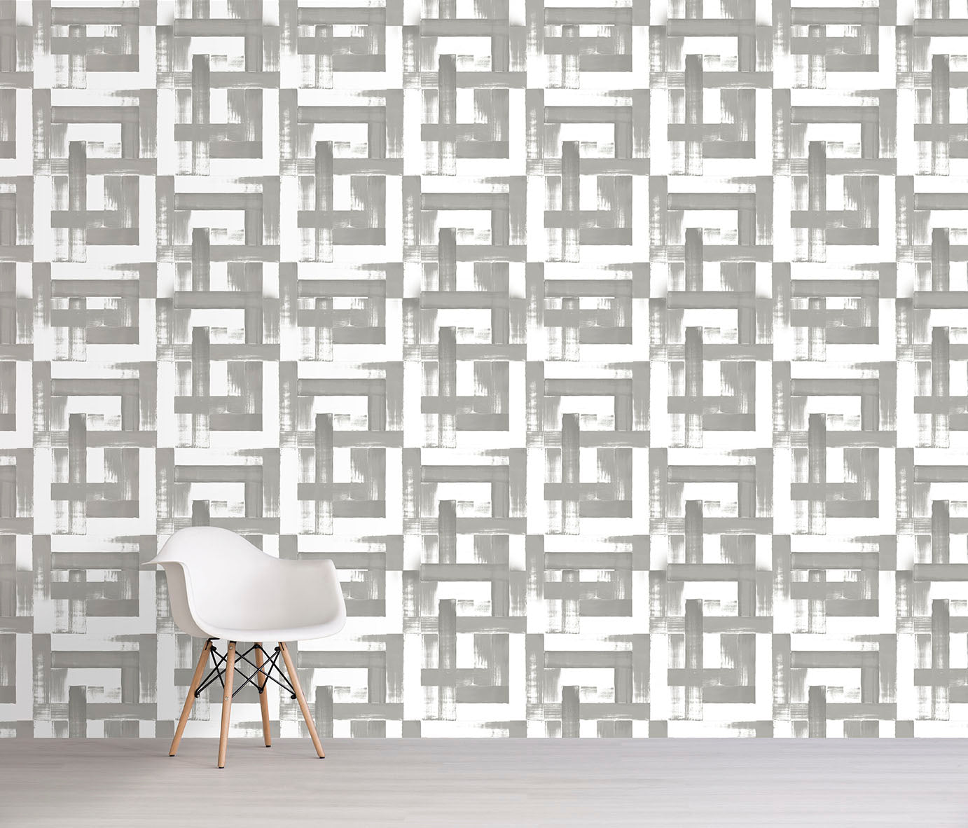 Geometric patterned wallpaper with a chair in front